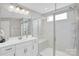 Modern bathroom with glass shower, white cabinets, and white counters at 2019 Taylorcrest Dr, Fort Mill, SC 29715