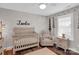 Comfortable Bedroom features a crib, chair, and woodland themed decor creating a soothing environment for the baby at 2019 Taylorcrest Dr, Fort Mill, SC 29715