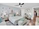 Stylized bedroom featuring white walls, a ceiling fan, and string lights adding to the ambience of the space at 2019 Taylorcrest Dr, Fort Mill, SC 29715