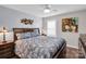 Inviting bedroom featuring a bed with decorative pillows, side tables with lamps and artistic wall decor at 2019 Taylorcrest Dr, Fort Mill, SC 29715