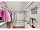 Organized walk-in closet with clothing racks, shelving and a globe adding personality and functionality to the space at 2019 Taylorcrest Dr, Fort Mill, SC 29715