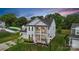 Charming two-story home with a double porch, manicured lawn, and colorful flower beds at 2019 Taylorcrest Dr, Fort Mill, SC 29715