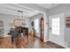 Elegant living room with a grand piano, decorative accents, and a welcoming ambiance, perfect for entertaining at 2019 Taylorcrest Dr, Fort Mill, SC 29715