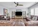 Spacious living room with leather sofas, entertainment unit, and a cozy ambiance for Gathering gatherings at 2019 Taylorcrest Dr, Fort Mill, SC 29715
