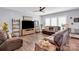 Comfortable living room with plush leather seating, entertainment center, and ample space for relaxation at 2019 Taylorcrest Dr, Fort Mill, SC 29715
