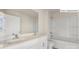 Bright white bathroom featuring a double sink vanity and tub shower at 2052 Harlequin Dr, Indian Trail, NC 28079