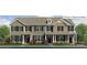 Charming townhome showcasing a beautiful facade and well-manicured landscaping at 2052 Harlequin Dr, Indian Trail, NC 28079