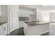 Modern kitchen island with granite countertops and shaker cabinets, with stainless faucet at 2052 Harlequin Dr, Indian Trail, NC 28079