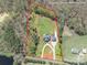 Expansive property featuring a home with a circular driveway, bordered by lush trees and greenery at 2236 Tuckaway Rd, Rock Hill, SC 29730