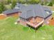 Aerial view of brick home, deck, and green lawn at 2236 Tuckaway Rd, Rock Hill, SC 29730