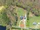 Aerial view of home surrounded by wooded lot and pond at 2236 Tuckaway Rd, Rock Hill, SC 29730