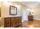 Dual vanities with wood cabinets and hardwood floors make this bathroom elegant at 2236 Tuckaway Rd, Rock Hill, SC 29730