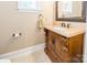 Bathroom featuring custom wood vanity, framed mirror, and tiled floors at 2236 Tuckaway Rd, Rock Hill, SC 29730