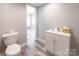 Bathroom featuring a white vanity with modern fixtures and a toilet at 2236 Tuckaway Rd, Rock Hill, SC 29730