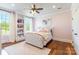 Light and bright bedroom featuring a large window, a ceiling fan and hardwood floors at 2236 Tuckaway Rd, Rock Hill, SC 29730