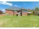 Exterior view of brick home with large backyard at 2236 Tuckaway Rd, Rock Hill, SC 29730
