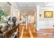 Elegant foyer featuring gleaming hardwood floors, decorative columns, and a view of the living space at 2236 Tuckaway Rd, Rock Hill, SC 29730