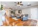 Bright and open living room boasts hard wood floors, modern decor and an inviting seating area at 2236 Tuckaway Rd, Rock Hill, SC 29730