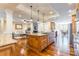 Spacious open concept living area with wood floors, large kitchen island, and recessed lighting at 2236 Tuckaway Rd, Rock Hill, SC 29730