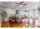 Spacious living room features wood floors, a ceiling fan and a comfortable seating arrangement at 2236 Tuckaway Rd, Rock Hill, SC 29730