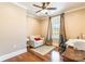 A bright home office featuring hardwood floors and a large window overlooking the yard at 2236 Tuckaway Rd, Rock Hill, SC 29730