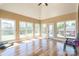 Bright sunroom with many windows, light hardwood floors, and access to the outdoors at 2236 Tuckaway Rd, Rock Hill, SC 29730
