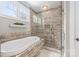 Bathroom with large soaking tub and glass shower at 232 Cromer St, Charlotte, NC 28208