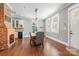 Elegant dining space featuring hardwood floors, a rustic table, and abundant natural light at 232 Cromer St, Charlotte, NC 28208