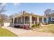 Beautiful home showcasing a spacious porch, garage, and well-manicured lawn, blending comfort and style at 232 Cromer St, Charlotte, NC 28208