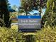 A sign for Eva B. Barber Neighborhood Park with lush greenery at 232 Cromer St, Charlotte, NC 28208
