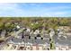 Expansive aerial shot of townhomes with solar panels, nestled in a lush, green neighborhood at 2446 Alyssa Ln, Charlotte, NC 28208