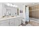 Bathroom with a double sink vanity and tiled shower-tub combo at 2446 Alyssa Ln, Charlotte, NC 28208
