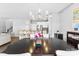 Formal dining room with chandelier flows into the eat-in kitchen area at 2446 Alyssa Ln, Charlotte, NC 28208