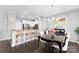 Open concept dining area with modern chandelier at 2446 Alyssa Ln, Charlotte, NC 28208