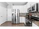 This kitchen offers stainless steel appliances and white cabinets at 2446 Alyssa Ln, Charlotte, NC 28208