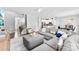Open-concept living area featuring modern decor and seamless flow to kitchen at 2446 Alyssa Ln, Charlotte, NC 28208