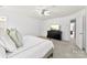 Bright main bedroom boasts a ceiling fan, ensuite access, and a large window at 2446 Alyssa Ln, Charlotte, NC 28208