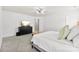 Bright main bedroom features neutral paint, plush carpet, and a sleek, black dresser at 2446 Alyssa Ln, Charlotte, NC 28208