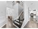 Elegant staircase with iron balusters leads to the upper level at 2446 Alyssa Ln, Charlotte, NC 28208