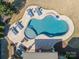 Aerial view of kidney shaped pool surrounded by tanning lounges and a seating area at 2616 Creek Manor Dr, Waxhaw, NC 28173