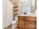 Bathroom featuring a wood vanity and built-in shelving at 2616 Creek Manor Dr, Waxhaw, NC 28173