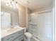 Modern bathroom with a walk-in shower, grey vanity with sink, and a white toilet at 2616 Creek Manor Dr, Waxhaw, NC 28173