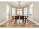 Bright dining room with large windows and a wooden table at 2616 Creek Manor Dr, Waxhaw, NC 28173