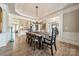 Open dining area with hardwood floors, detailed molding, and seamless access to the kitchen and living spaces at 2616 Creek Manor Dr, Waxhaw, NC 28173