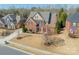 Aerial view of a beautiful two-story brick home with well-maintained landscaping at 2616 Creek Manor Dr, Waxhaw, NC 28173