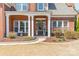 Charming brick home featuring a covered entryway, decorative landscaping, and a welcoming front door at 2616 Creek Manor Dr, Waxhaw, NC 28173