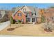Charming two-story brick home featuring a manicured front yard and covered front porch at 2616 Creek Manor Dr, Waxhaw, NC 28173