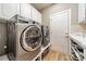 Modern laundry room with stainless steel washer and dryer at 2616 Creek Manor Dr, Waxhaw, NC 28173