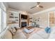 Cozy living room with a fireplace, built-in shelving, and comfortable seating, ideal for relaxation at 2616 Creek Manor Dr, Waxhaw, NC 28173
