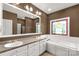 Bathroom features double sinks, a soaking tub, and a decorative stained-glass window at 282 W Shiloh Unity Rd, Lancaster, SC 29720